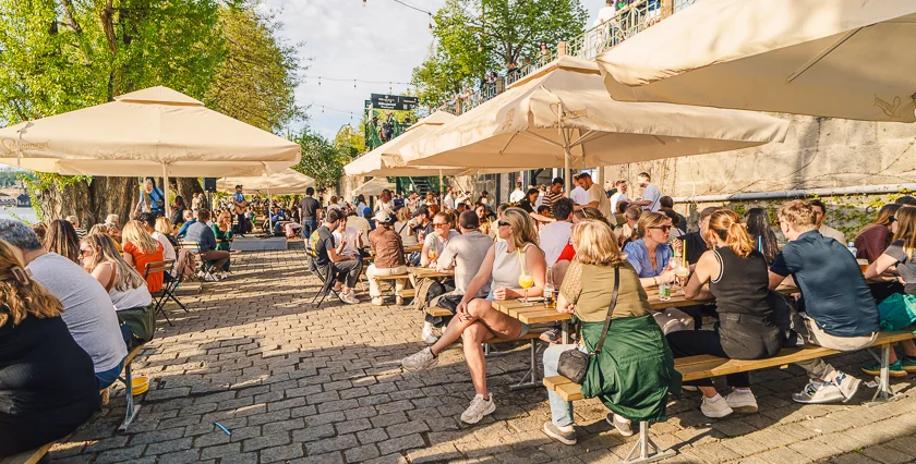 a-riverside-summer-terrace-outdoor-seating-by-the-vltava-refreshing-drinks-it-ehmdt.webp