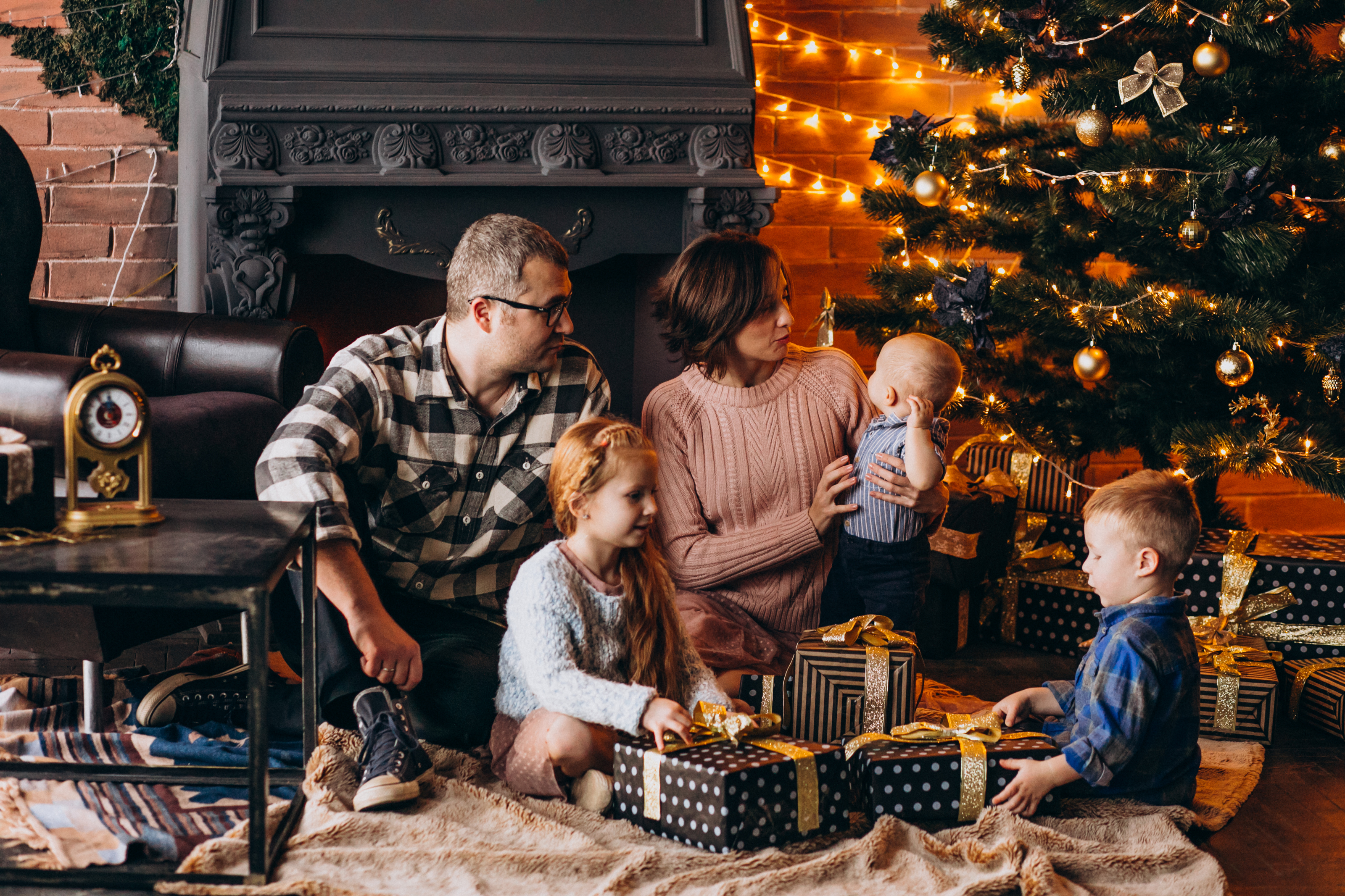 big-family-christmas-eve-with-presents-by-christmas-tree.jpg