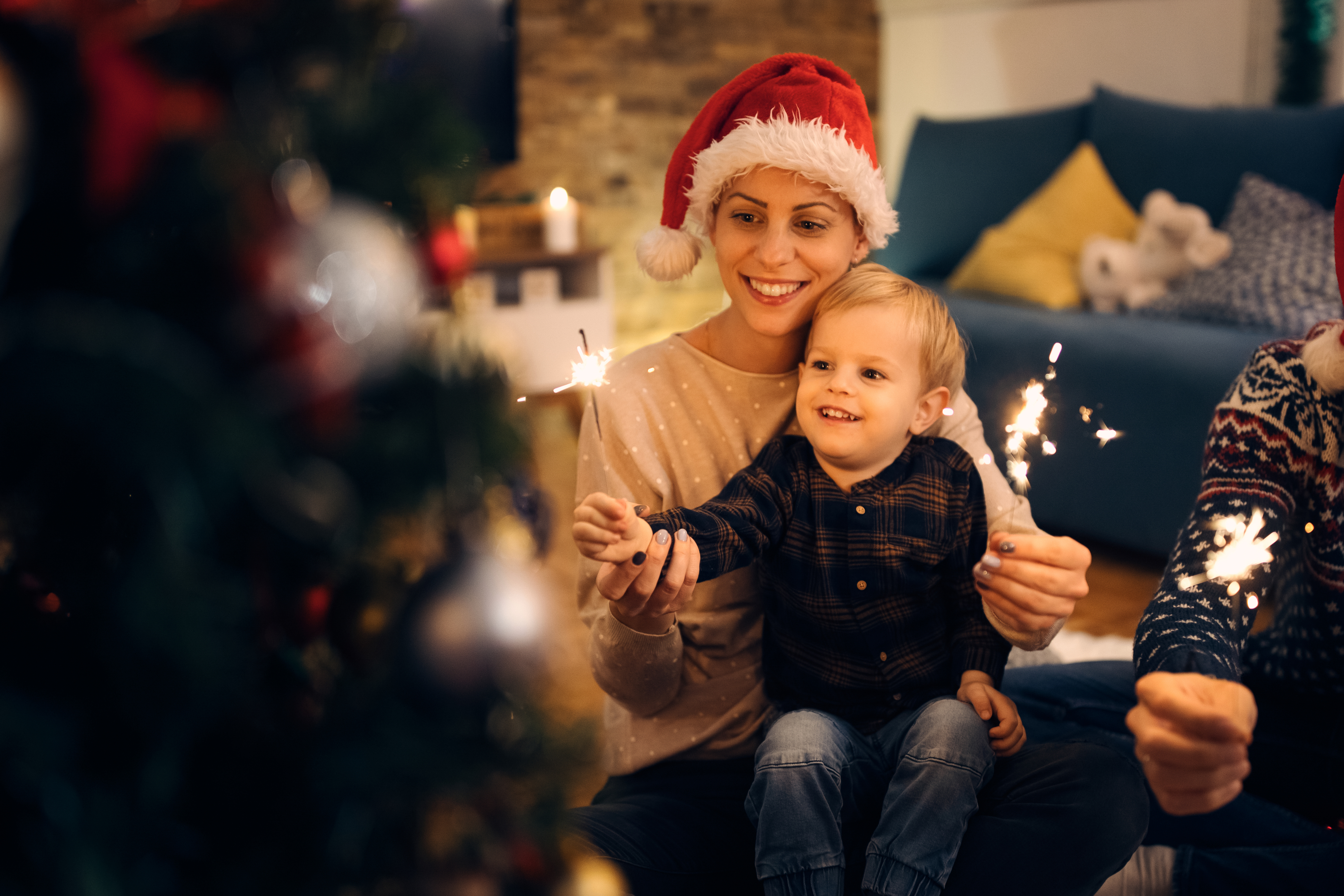 happy-mother-her-small-son-having-fun-with-sparklers-christmas-eve.jpg