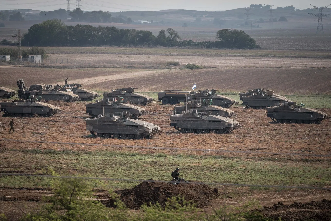 israeli-armored-vehicles-are-seen-in-a-field-outside-erez-israel-on-saturday-new-york-times-1697330730907.webp