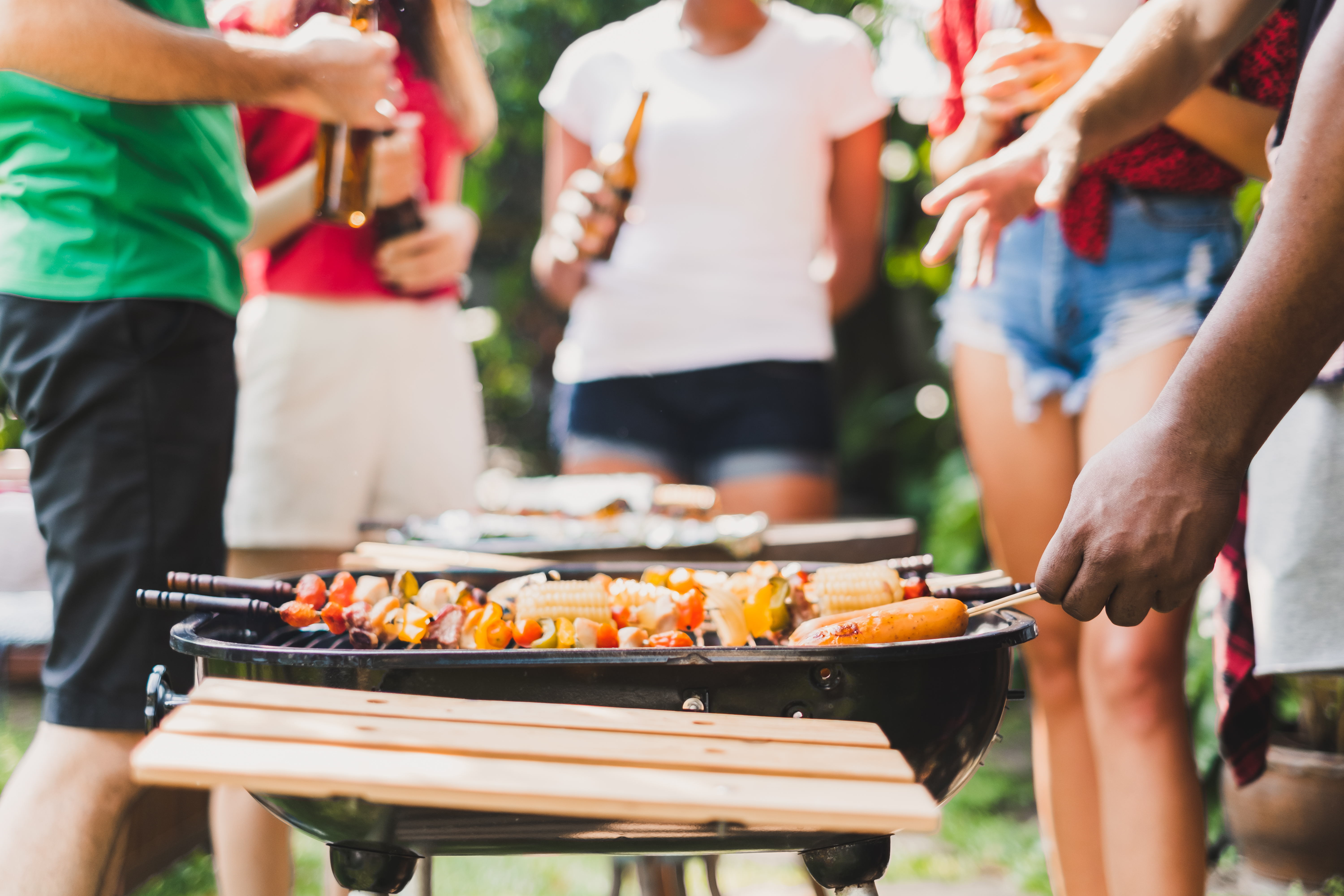midsection-people-enjoying-by-barbecue-grill.jpg