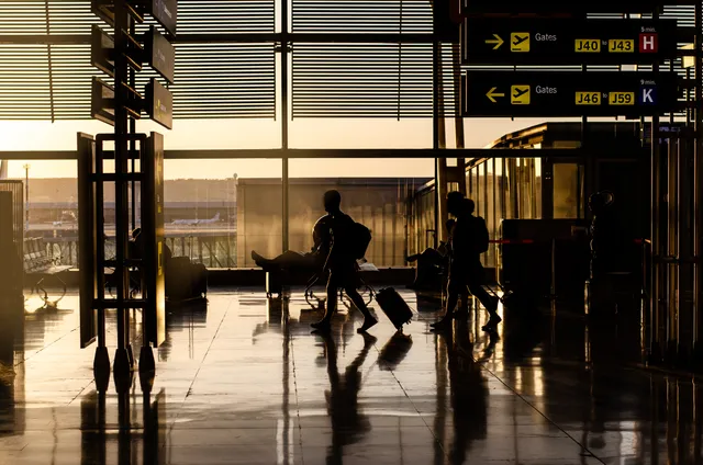 people-walking-inside-airport-terminal-72881720258266315229056.webp