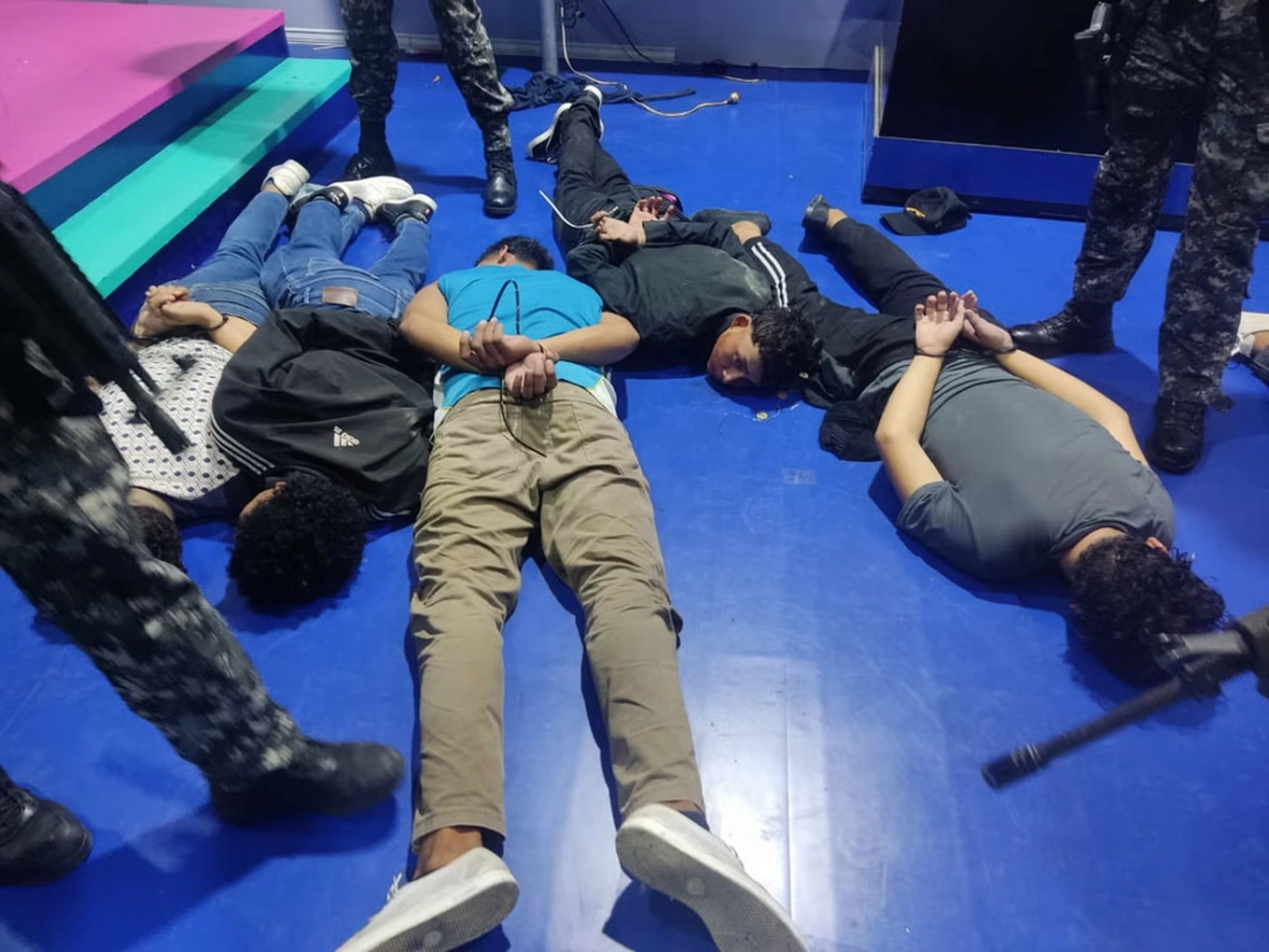 suspects-handcuffed-at-the-tc-television-studio-after-police-arrived-x-ecuador-police-1704849692084.webp